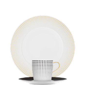 Teller mit goldenem Punktmuster, Tasse mit schwarzem Punktmuster vorne. Fürstenberg Porzellan. Teller mit goldenem Punktmuster, Tasse mit schwarzem Punktmuster vorne. Fürstenberg Porzellan.