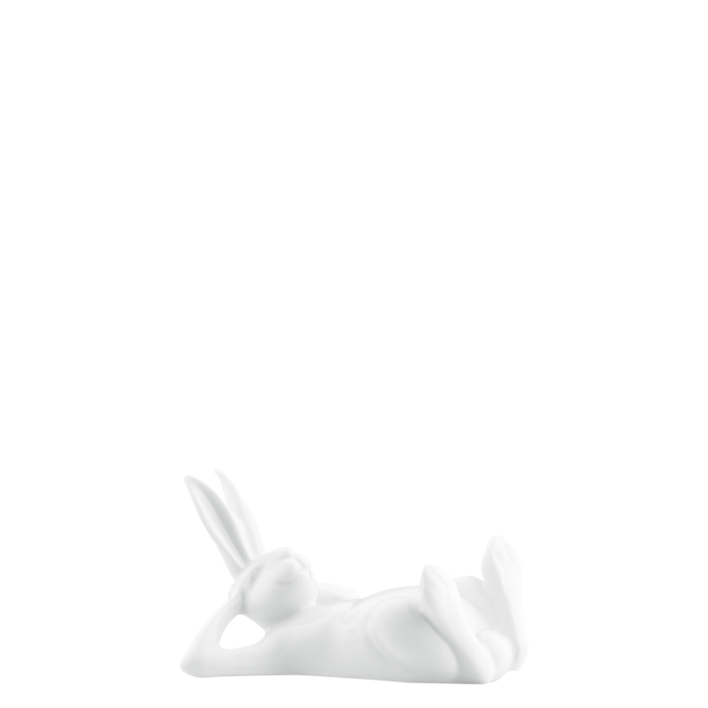 img1_pl175510weiss_hase_2003_der_geniesser Weiße Hasenfigur liegt entspannt mit hinter dem Kopf verschränkten Armen. Fürstenberg Porzellan.